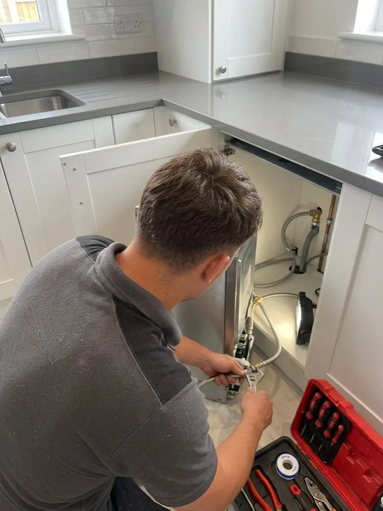 Oakley working in a kitchen installation