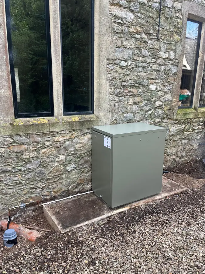 External oil boiler at a stone cottage